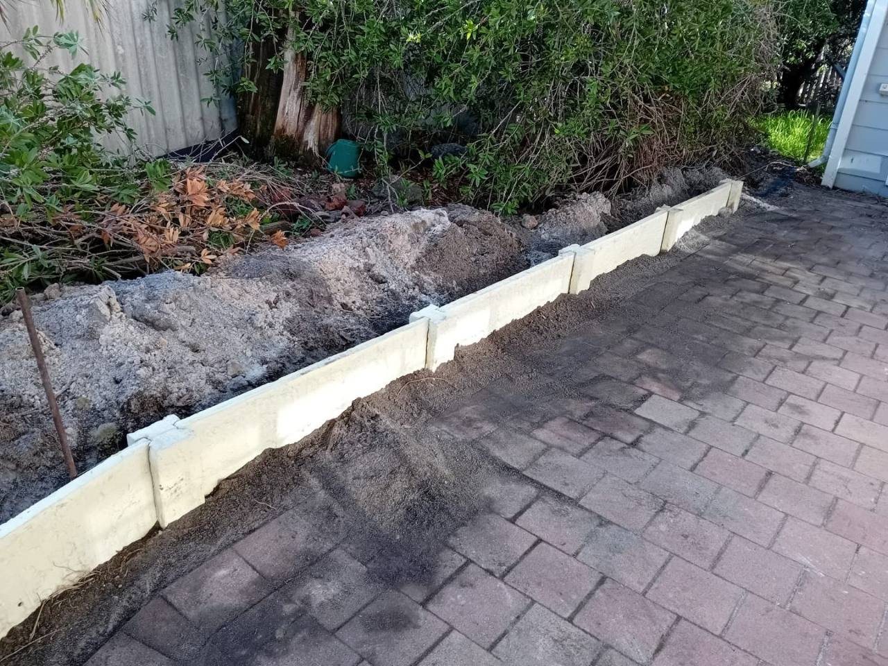 Work in progress: retaining wall along the garden bed